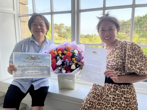 Aya and Mokoti with flowers, OSOBS certificate and membership letter<br>