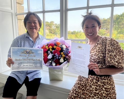 Aya and Mokoti with flowers, OSOBS certificate and membership letter<br>