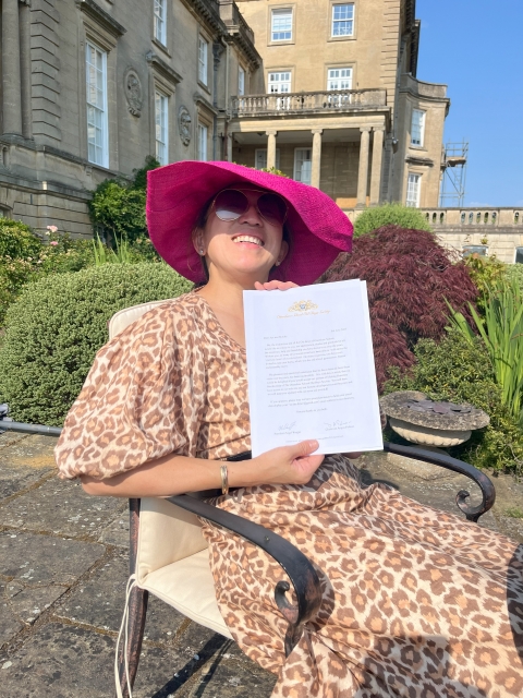 Aya shows off her OSOBS invitation letter <br>