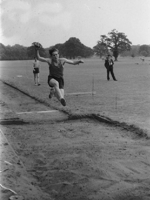 Long jump -  ‘Olly’ Palmer (East House) c.1960<br>© Mike Leggett