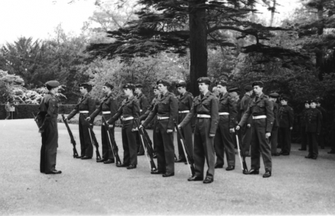 The parade on the forecourt in front of the school entrance, probably Battle of Britain Day <br>This probably occurred on Battle of Britain Day with a visit by a regional official. These faces are familiar, Arthur Foot is visible within the inspecting party, but none of my friends were enrolled. I took the picture probably because I came from an Air Force family, my father had recently finished serving, and though the ATC was a bit of a Dad’s Army outfit, there was a certain nostalgia for the romance of Air Force blue. ©Mike Leggett
